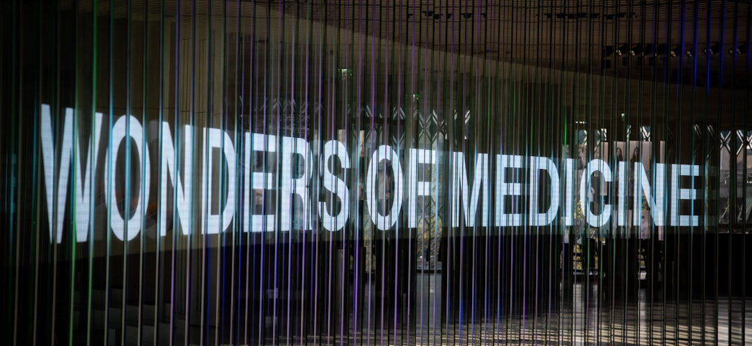 Wonders of medicine sign illuminated at night